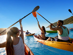 group of friends paddling on the water staying hydrated
