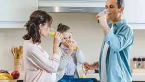 Family preparing electrolytes in the morning sunlight to start their day. 