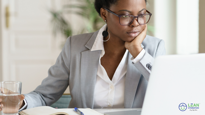 Busy female professional staying focused on computer.